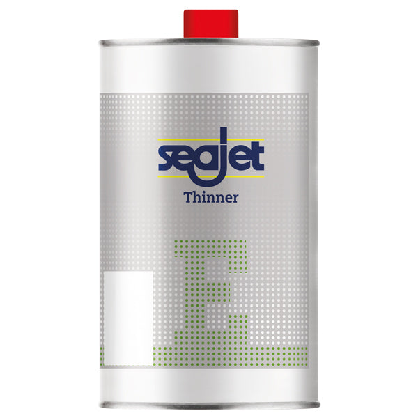SeaJet Thinner E 1L stående på en arbejdesbænk med værktøj.